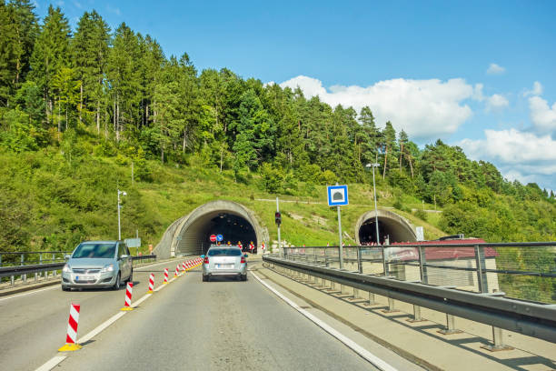 istock tunnel entrance / exit with cars, highway 845818132