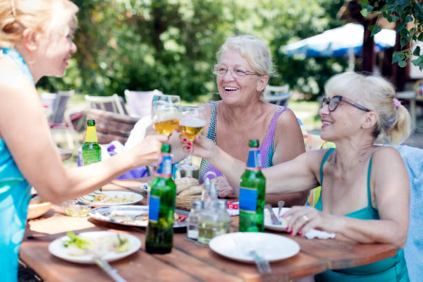 istock Social seniors toasting with beer 845830702