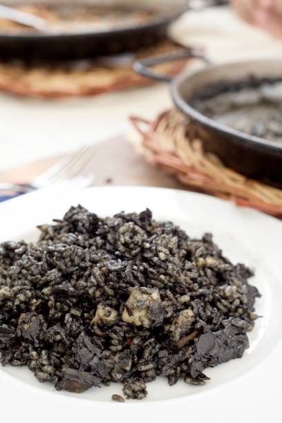 istock spanish arroz negro or black paella 845839656