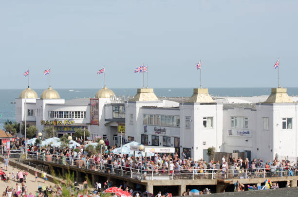 Large crowd on front of Clacton Pier for airshow Clacton  Essex United Kingdom  -25 August  2017: Large crowd on front of Clacton Pier for airshow clacton on sea stock pictures, royalty-free photos & images