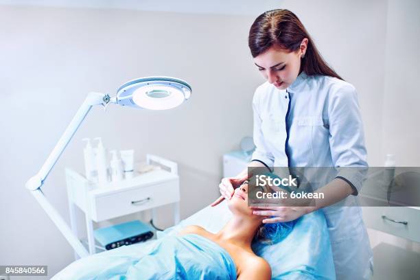 The Cosmetologist Is Caring For The Patients Face Stock Photo - Download Image Now - Beautician, Doctor, Dermatology