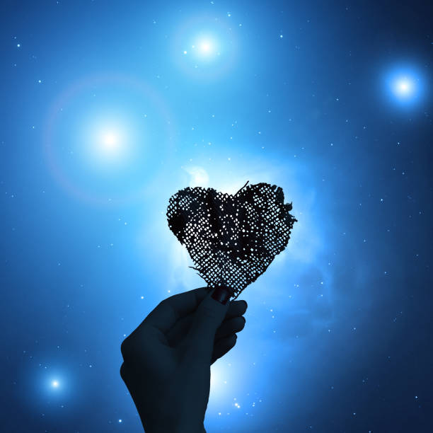 istock Hand with a heart shape and starry background. Elements of this image are my work. 845840970