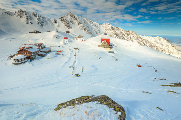 Stunning winter landscape with frozen Balea lake, Transylvania, Romania, Europe Spectacular winter landscape in Fagaras mountains with famous frozen Balea lake and wooden houses, Carpathians, Transylvania, Romania, Romania balea lake romania stock pictures, royalty-free photos & images