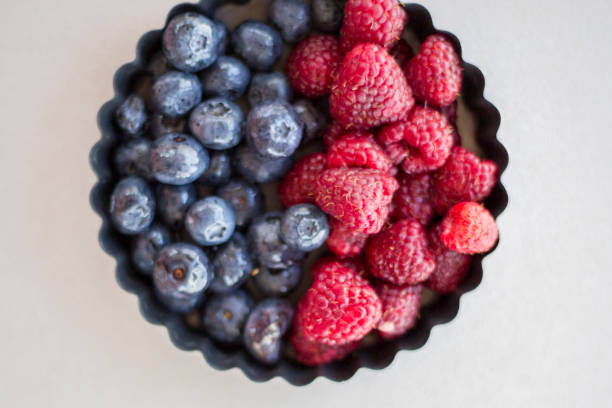 istock Healthy mixed fruit and ingredients with strawberry, raspberry, blueberry, blackberry from top view 845843852