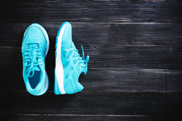 istock sneakers on wooden floor 845843874