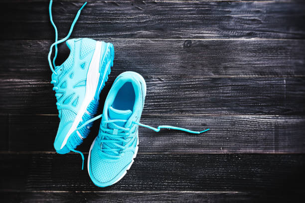istock sneakers on wooden floor 845844158
