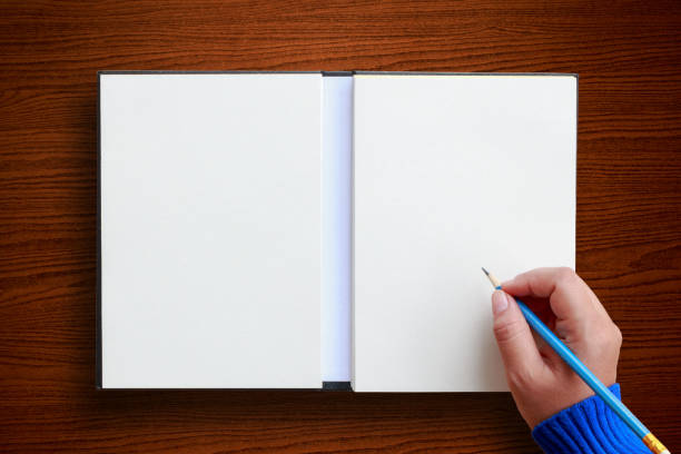 istock Female hand with spring shirt writing something 845844266