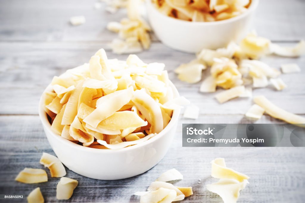 coconut chips healthy snacks coconut chips in bowl Coconut Stock Photo