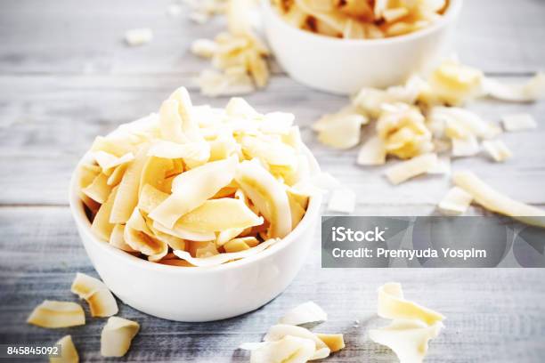 Coconut Chips Stock Photo - Download Image Now - Coconut, Baking, Brown