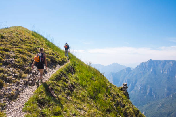 istock Mountaineers walking on high mountain path 845847744