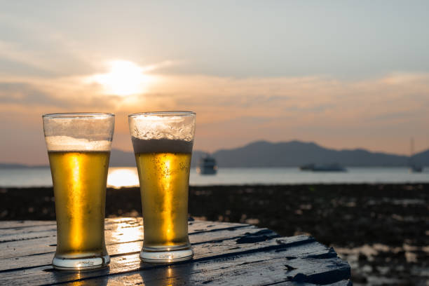 istock Glass of beer on a sunset 845848788