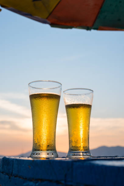 istock Glass of beer on a sunset 845848962