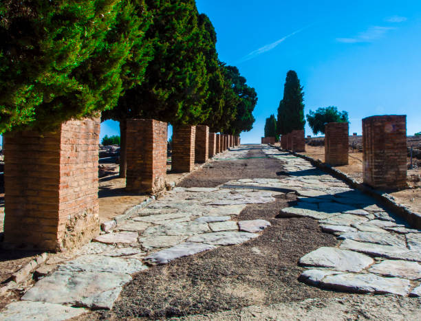 Ancient Roman road in Italica. Ancient Roman road in Italica. Street in the Roman ruins of Italica. Santiponce. Sevilla. Spain. italica spain stock pictures, royalty-free photos & images