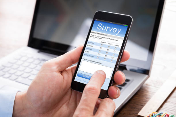 istock Businessman Filling Survey Form On Mobile Phone 845854842