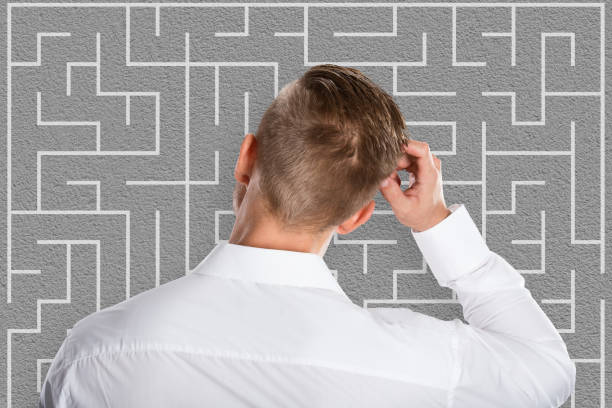 istock Young Businessman Looking At Labyrinth 845859108