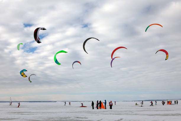 Winter sports. Ski kiting on a snowy river.