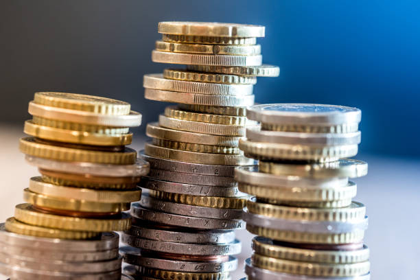 istock euro coins in a pile at table. close up 845860370