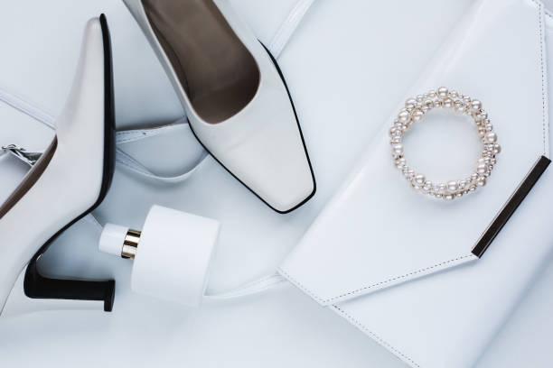 istock white female accessories. Handbag with perfume and shoes 845864460