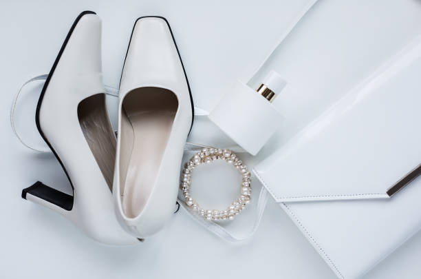istock white female accessories. Handbag with perfume and shoes 845864538
