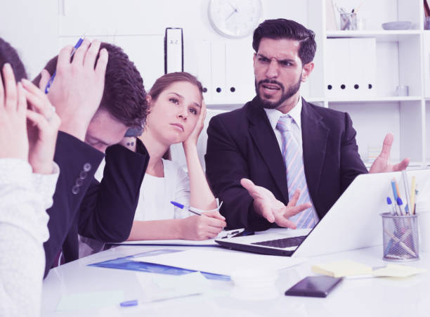 istock Outraged manager with colleagues at meeting 845872872