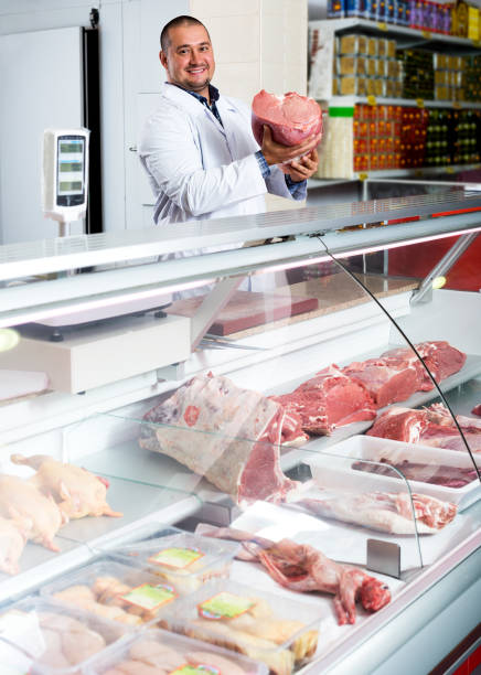 istock Male butcher in fresh meat section 845873224