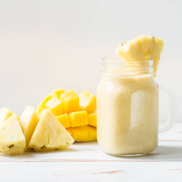 istock Mango, Banana, Pineapple and Oatmeal Smoothie in the Jar 845876792