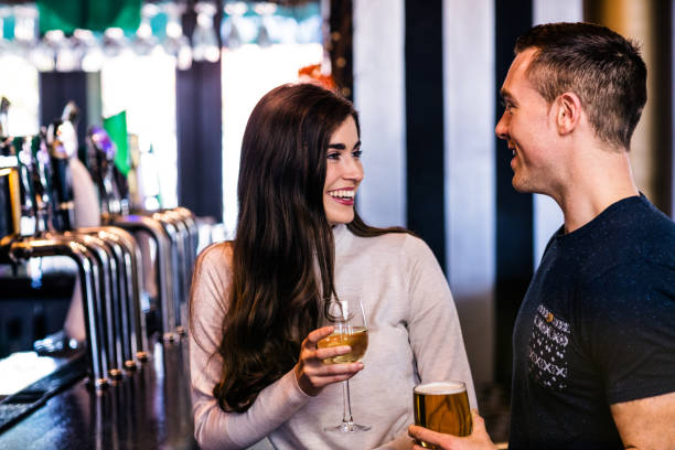 istock Cute couple talking in a bar 845877164