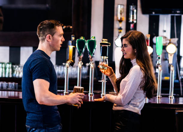 istock Cute couple talking in a bar 845877240