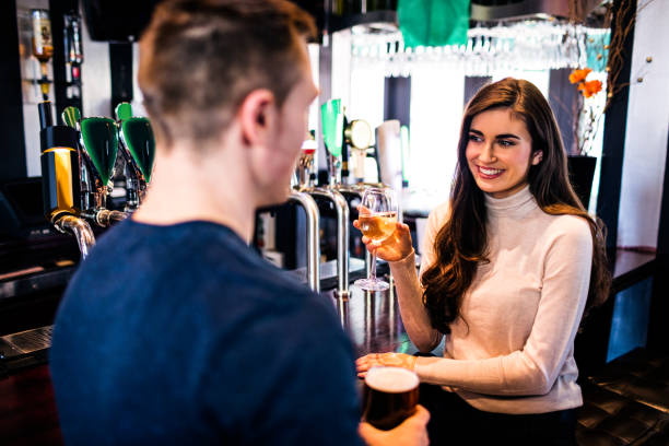 istock Smiling couple having a drink together 845877268