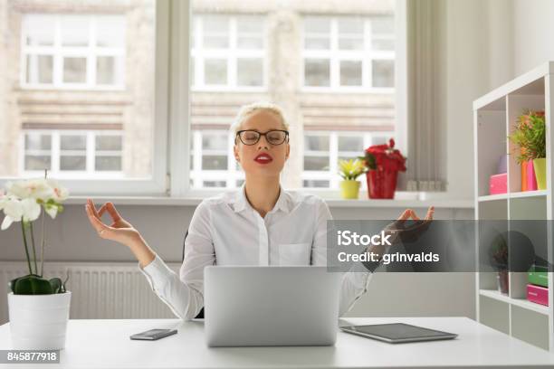 Woman In Office Meditating Stock Photo - Download Image Now - Emotional Stress, Office, Place of Work