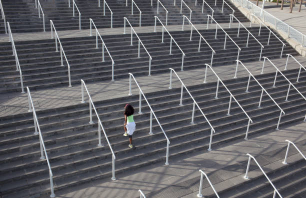 istock Woman doing exercises on the stadium porch. 845878828