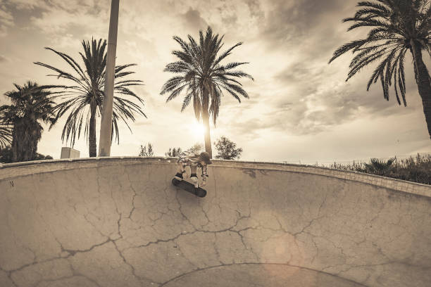 istock Young woman skating in skateboard park 845881872