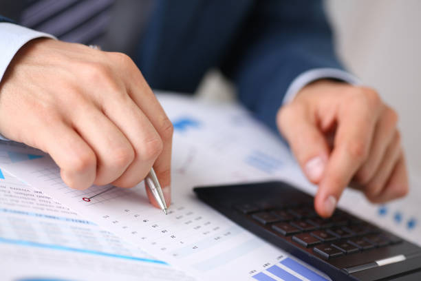 istock Black calculator and financial statistics on infographics 845882108