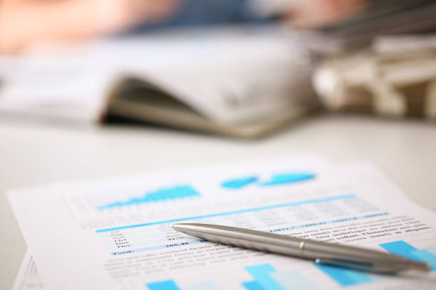 istock Financial statistics documents on clipboard pad at office table closeup 845882138