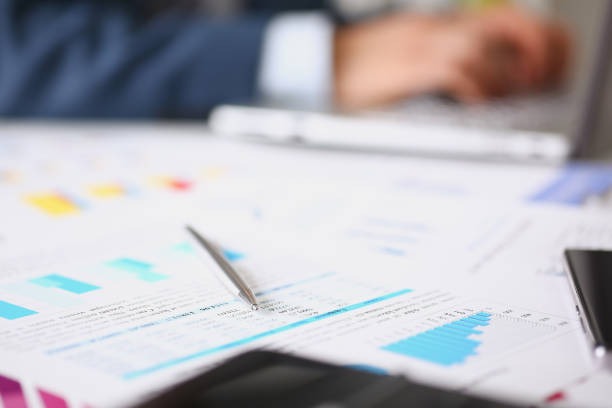 istock Financial statistics documents on clipboard pad at office table closeup 845882268