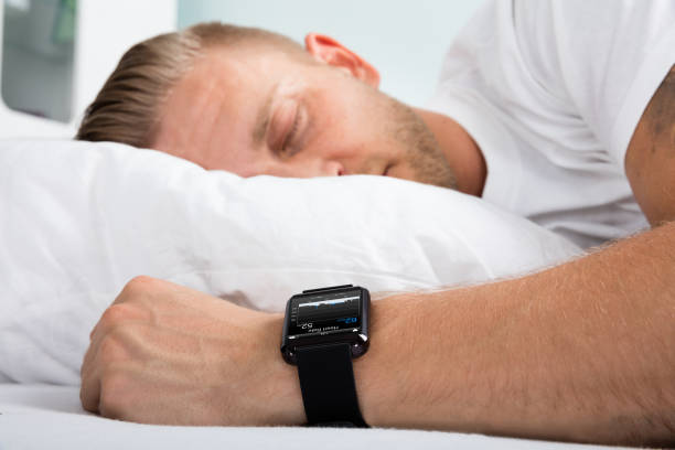 istock Man Sleeping With Smart Watch In His Hand 845885142