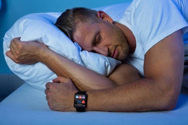 istock Man Sleeping With Smart Watch In His Hand 845885672
