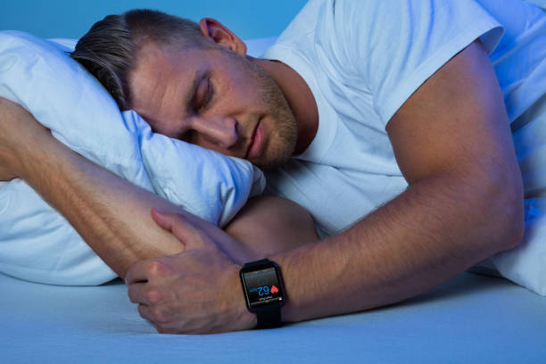 istock Man Sleeping With Smart Watch In His Hand 845885786