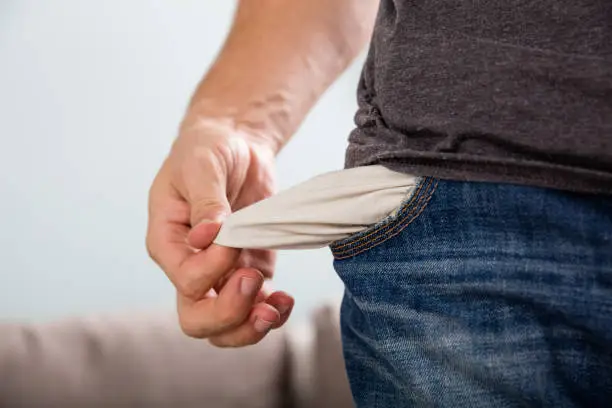 Photo of Man Showing His Empty Pocket