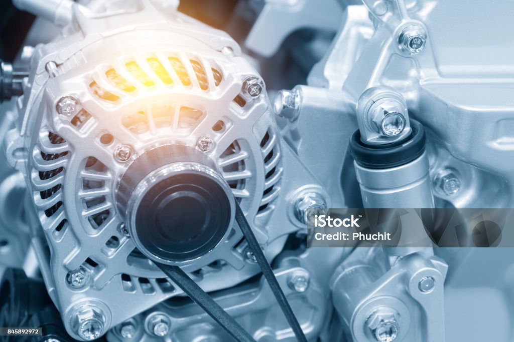 The car alternator in the light blue scene The car alternator in the light blue scene with the lighting effect.Automotive part. Automobile Industry Stock Photo