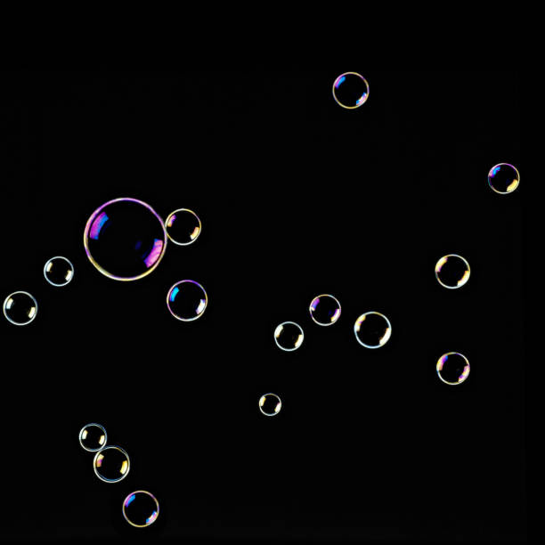 istock SOAP bubbles, floating in the black background glow 7 color 845893276