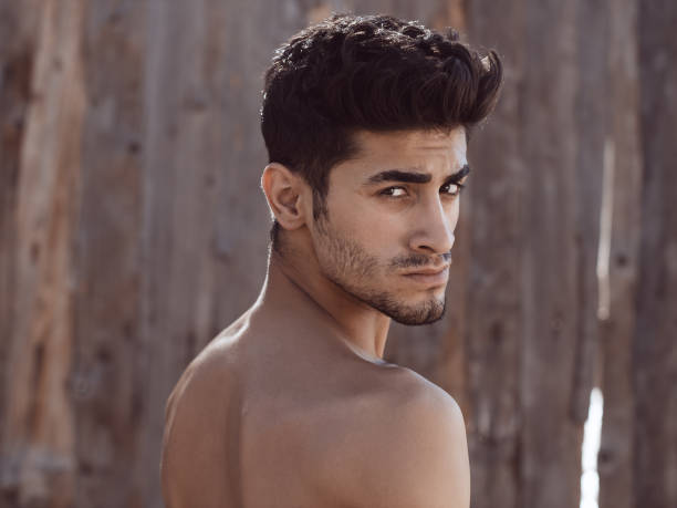 istock Handsome topless young man outdoors 845893562