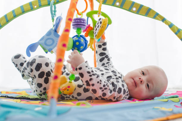 istock Happy baby boy smiling on playmat 845897346
