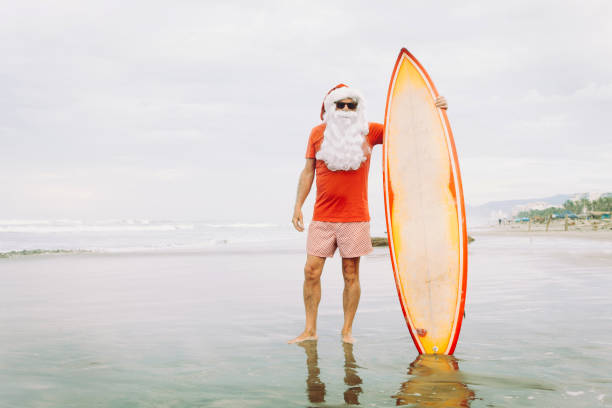 istock Santa Claus with surf board 845905752