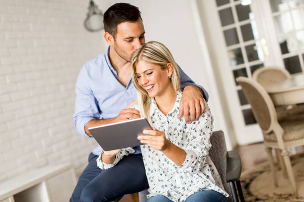 istock Young couple with tablet in the room 845911214