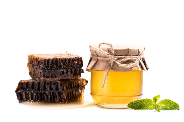 istock honeycombs and honey in glass jar 845911964