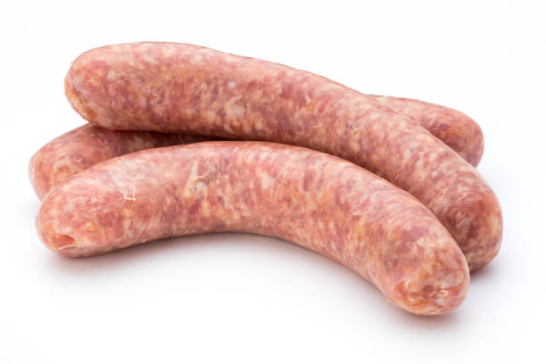 istock Raw sausage with parsley leaf isolated on white background. 845914598