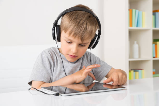 istock Boy Listening Music On Digital Tablet 845915716