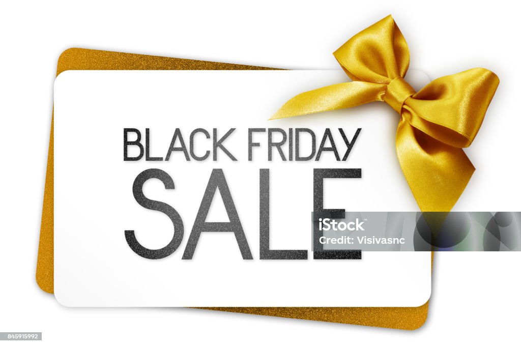 Black Friday sale text write on white gift card with golden ribbon bow Gift Certificate or Card Stock Photo