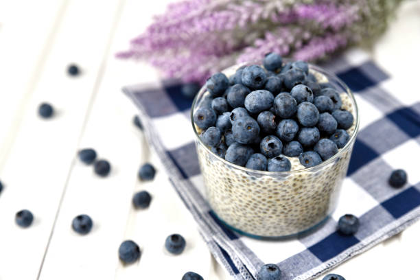 istock Chia pudding with blueberries on striped canvas, white wood background 845916188